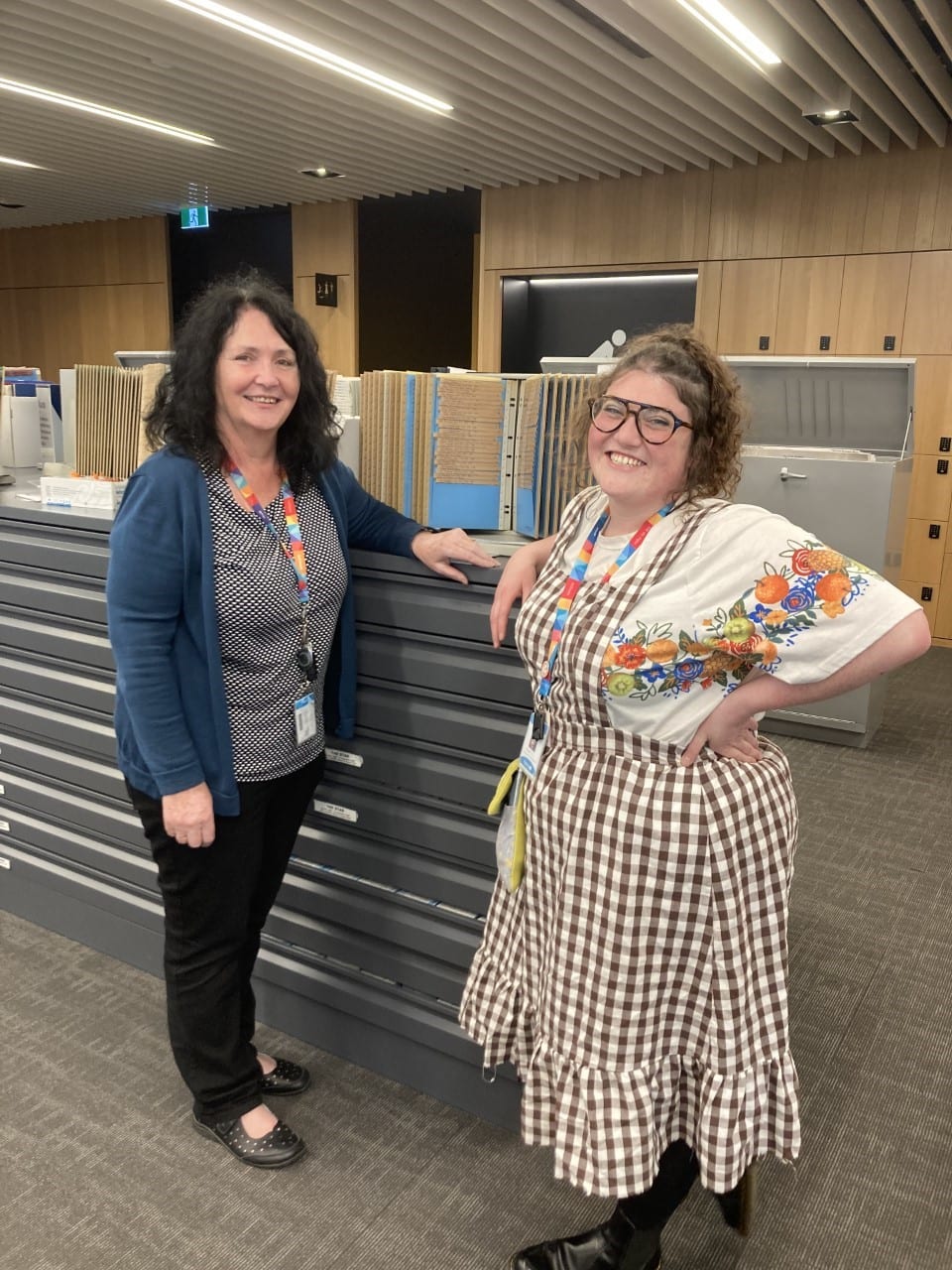 Lyn Gifford (Librarian – Family History) chats with Poppia Marriott (Library Assistant) about Christchurch Heritage Festival.